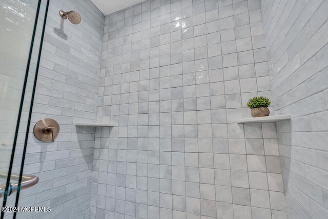 bathroom with a tile shower