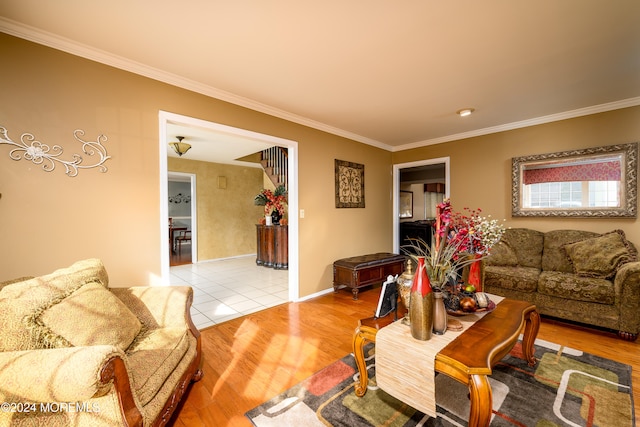 living room featuring ornamental molding and light wood-type flooring