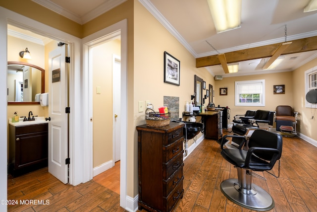 home office featuring sink, coffered ceiling, beamed ceiling, dark wood-type flooring, and crown molding