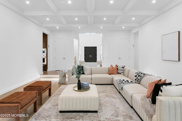 living room with beamed ceiling, light wood-type flooring, and coffered ceiling