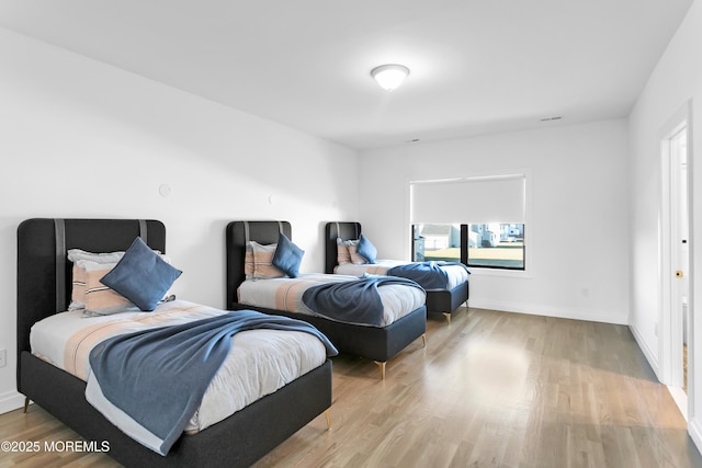 bedroom featuring light hardwood / wood-style floors