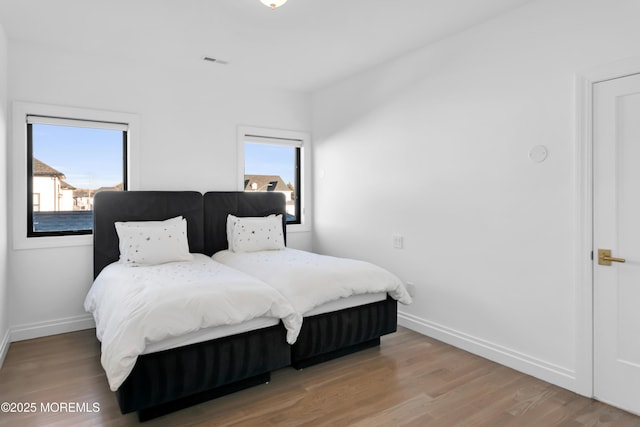 bedroom featuring wood-type flooring