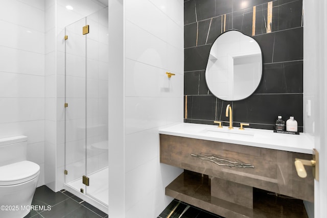 bathroom with tile patterned flooring, toilet, and tile walls