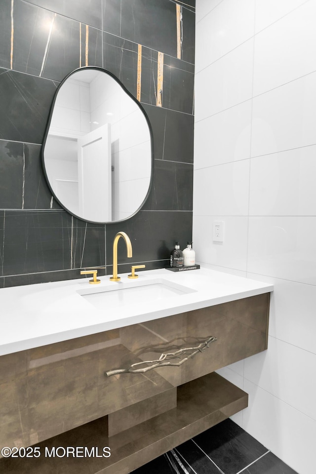 bathroom featuring tile patterned floors, vanity, and tile walls