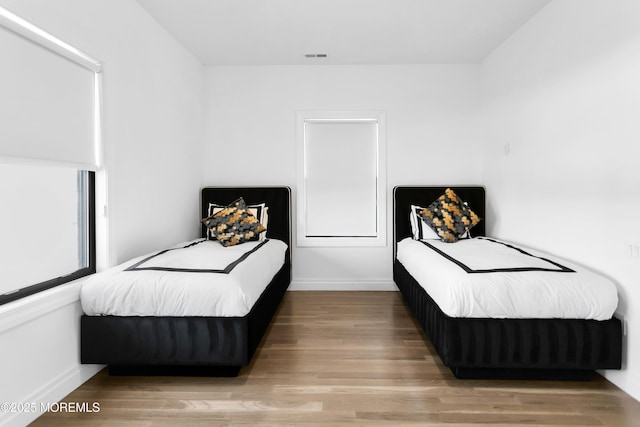 bedroom featuring wood-type flooring