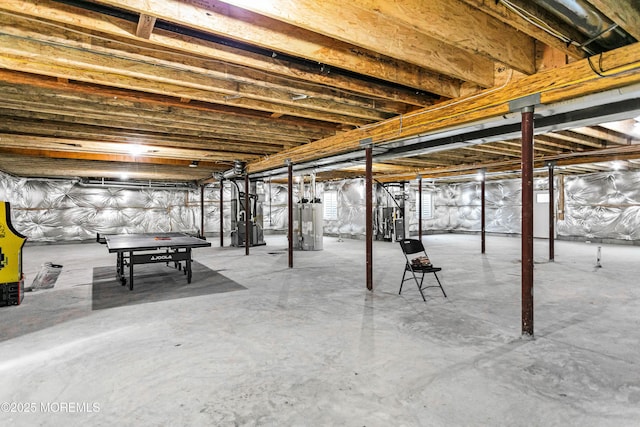 basement featuring heating unit and water heater