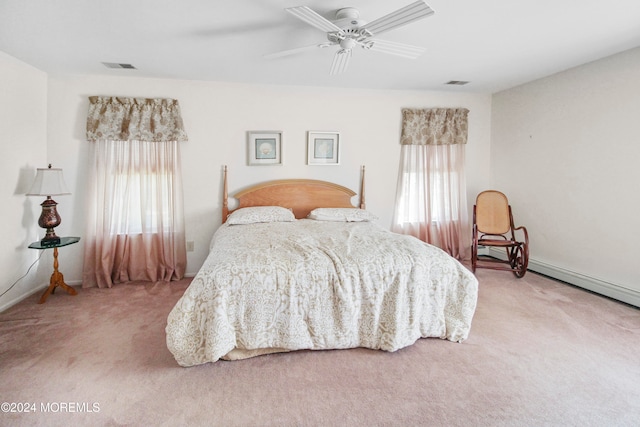 bedroom featuring multiple windows, carpet floors, and ceiling fan