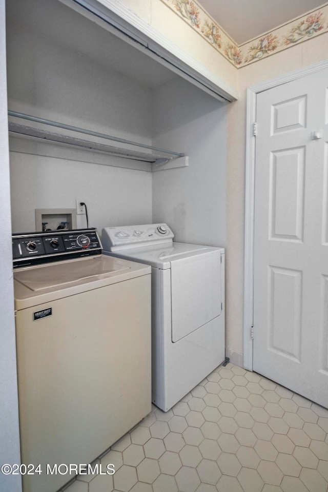 laundry room with independent washer and dryer