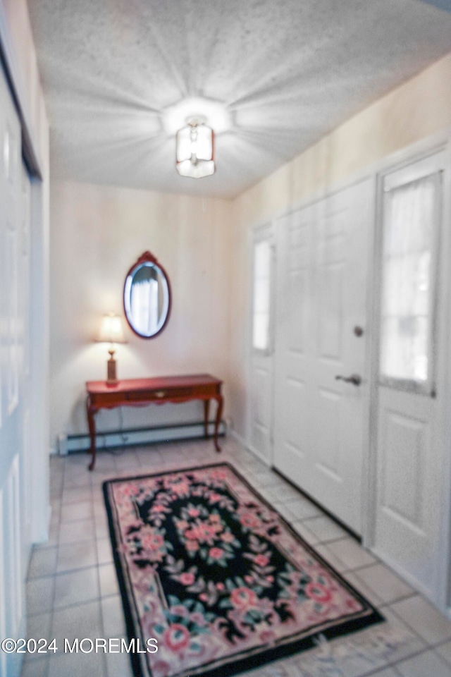 foyer with a textured ceiling