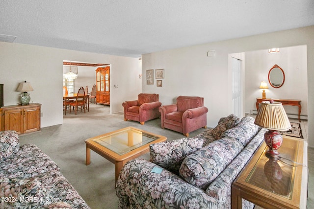 living room featuring baseboard heating, a textured ceiling, and light colored carpet