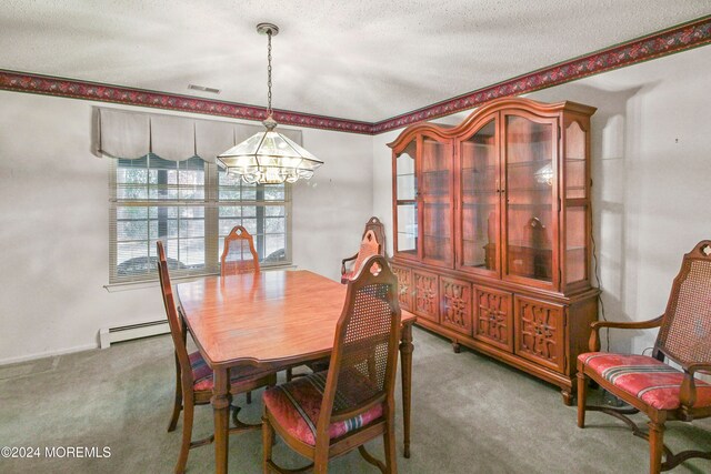 dining space featuring a notable chandelier, a textured ceiling, a baseboard radiator, and carpet