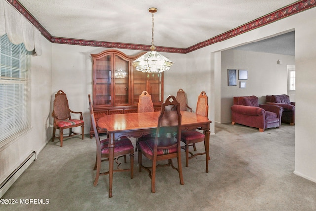 dining area with a notable chandelier, carpet, a textured ceiling, and baseboard heating