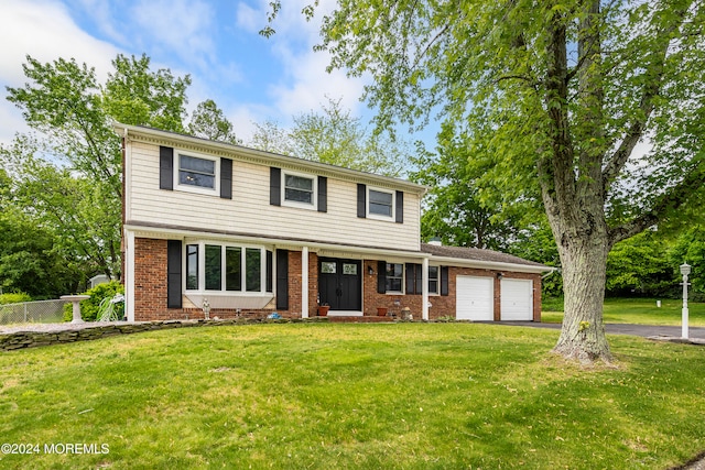 59 Westbrook Rd, Howell, NJ 07731 - view of front of property with a front lawn and a garage