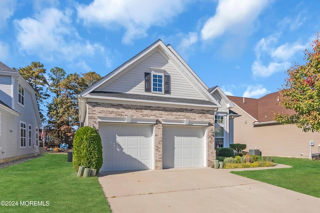 view of front of home with central AC unit, a garage, and a front yard