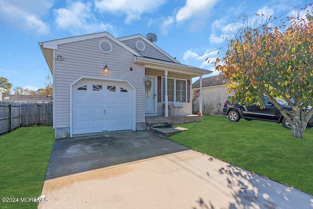 view of front of house with a front lawn and a garage