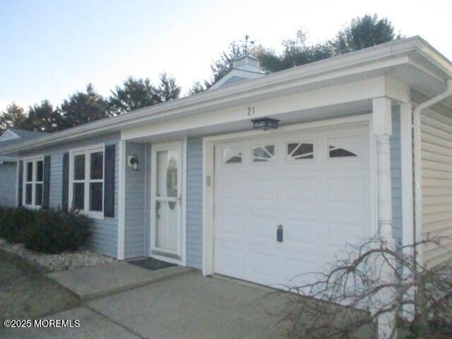 ranch-style home featuring a garage