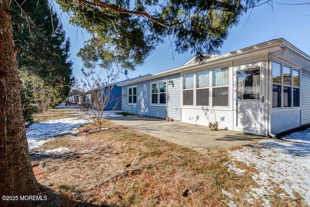 rear view of property with a patio area