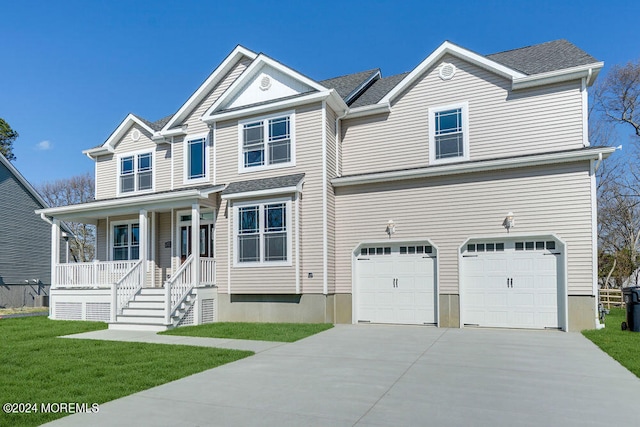 view of front of home featuring covered porch, a front yard, and a garage