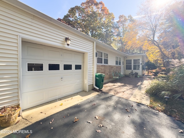 view of side of home with a garage