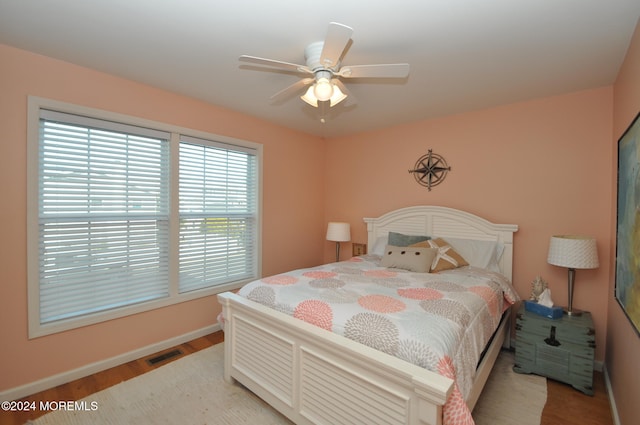 bedroom featuring ceiling fan and hardwood / wood-style floors