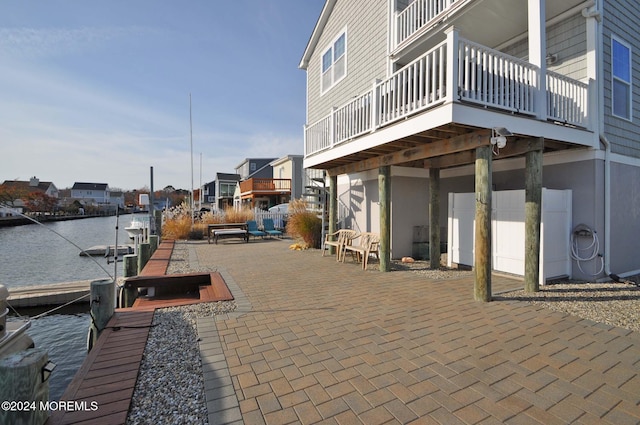 exterior space with a patio and a water view