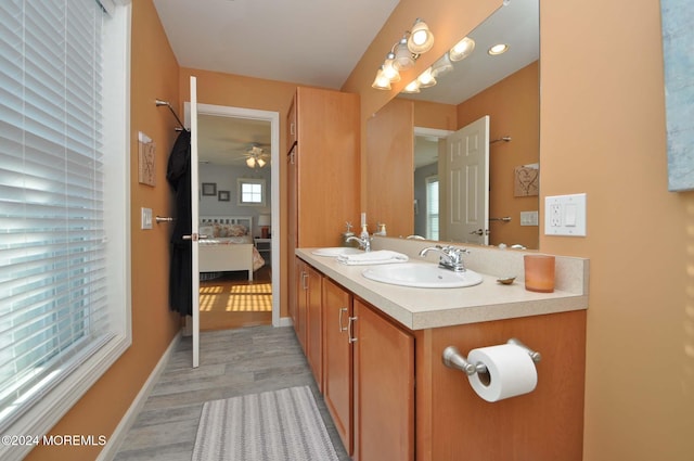 bathroom featuring vanity, hardwood / wood-style flooring, and ceiling fan