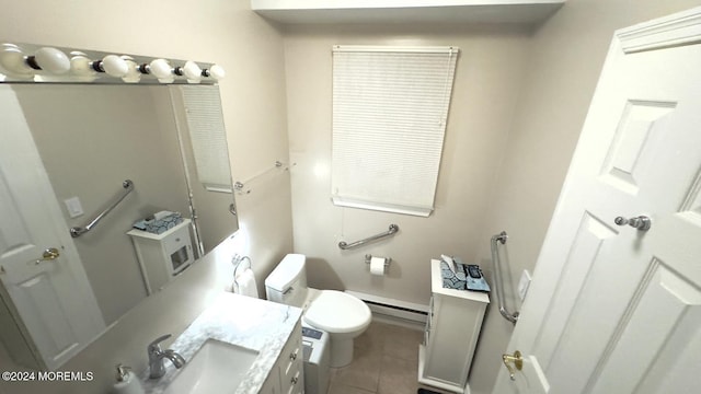 bathroom with tile patterned floors, vanity, a baseboard radiator, and toilet