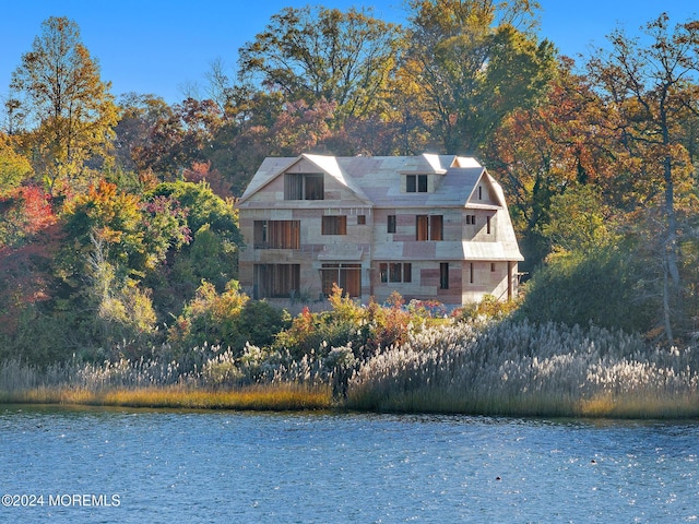 exterior space with a water view