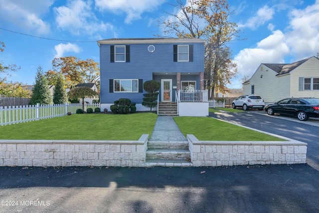 front facade featuring a front lawn