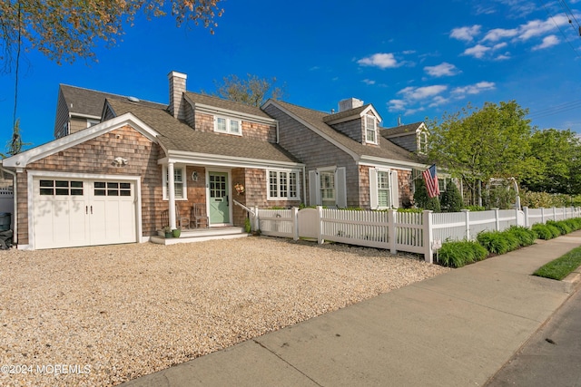 cape cod-style house with a garage