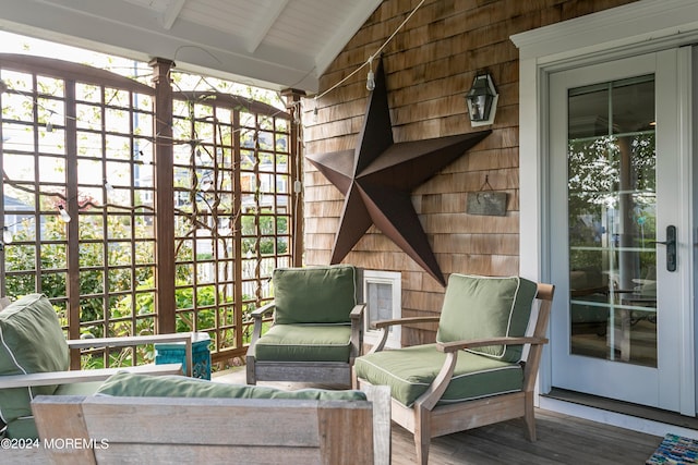 exterior space with vaulted ceiling and plenty of natural light