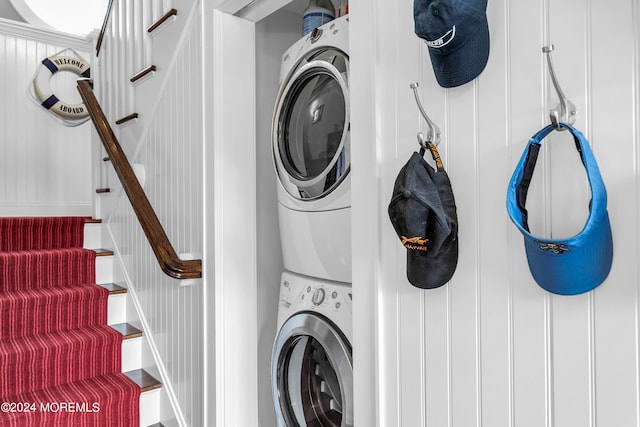 washroom featuring stacked washer / dryer