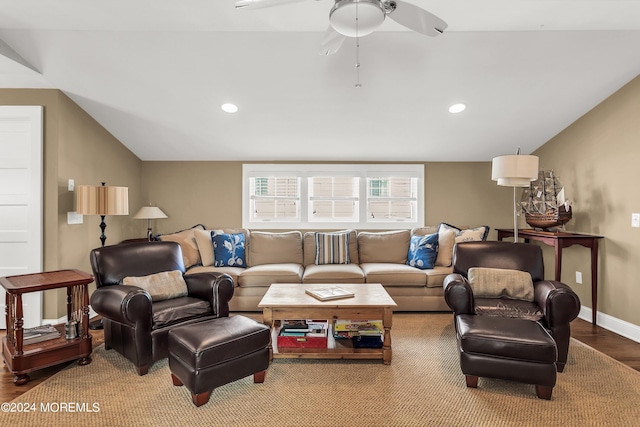 living room with vaulted ceiling, hardwood / wood-style flooring, and ceiling fan