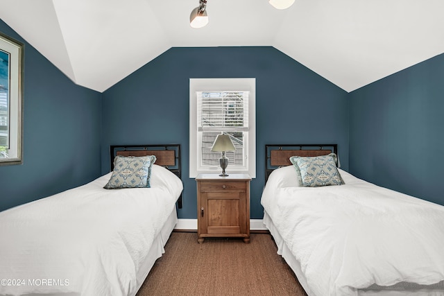 carpeted bedroom featuring lofted ceiling