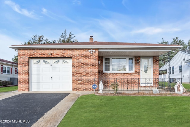 view of front facade with a garage and a front lawn