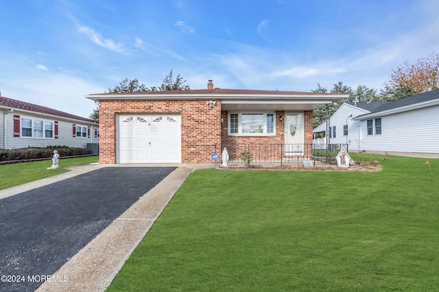 view of front of house featuring a garage and a front yard