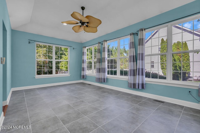 unfurnished sunroom with ceiling fan and lofted ceiling