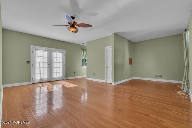 spare room featuring french doors, light hardwood / wood-style flooring, and ceiling fan