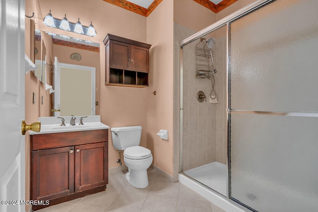 bathroom featuring vanity, toilet, tile patterned floors, and walk in shower