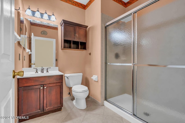 bathroom featuring walk in shower, toilet, vanity, crown molding, and tile patterned floors