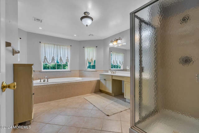 bathroom with vanity, independent shower and bath, and tile patterned flooring