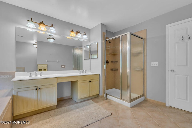 bathroom with vanity, walk in shower, and tile patterned floors