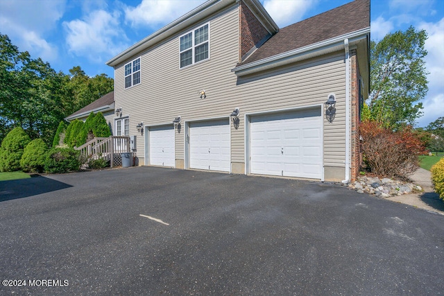 view of property exterior featuring a garage