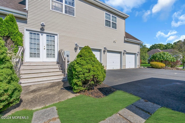 view of side of home featuring a garage