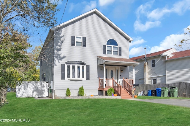 front facade featuring a front yard