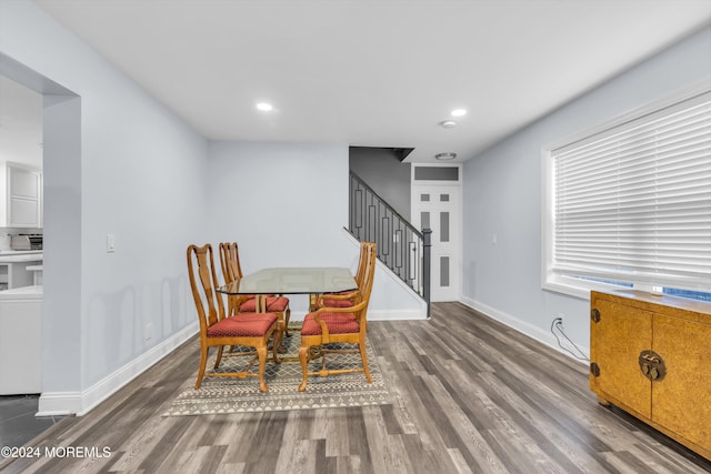 dining space with dark hardwood / wood-style floors