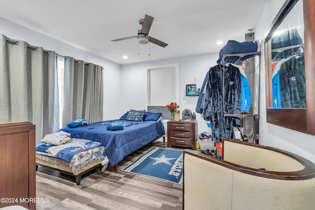 bedroom featuring hardwood / wood-style floors and ceiling fan