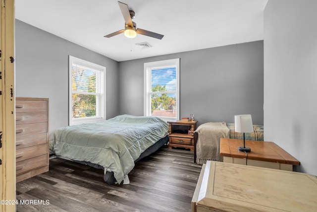 bedroom featuring dark wood-type flooring and ceiling fan