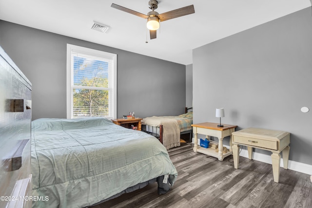 bedroom featuring dark hardwood / wood-style floors and ceiling fan