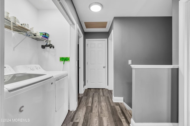 washroom featuring washer and clothes dryer and dark hardwood / wood-style floors